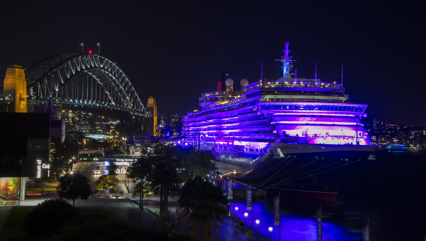 Queen Victoria illuminated in purple at Sydneys Circular Quay for International Womens Day 2016 Credit James Morgan